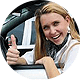 woman in car giving thumbs up