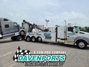 Davenports’ heavy towing wrecker gently pivoting the semi cab for a safe un-decking